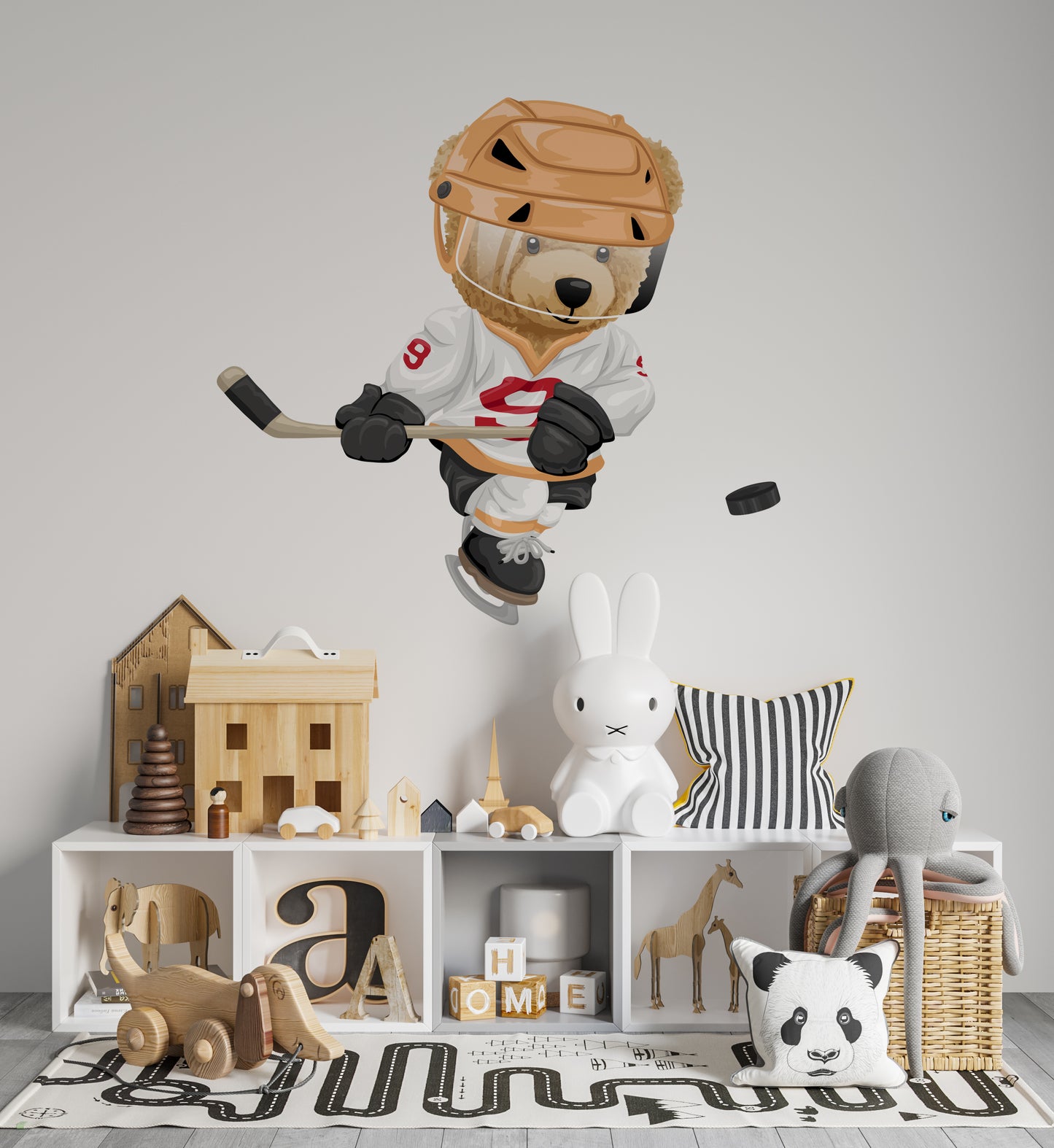 Jugador de hockey sobre hielo con osito de peluche